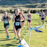 Port Angeles freshman Zakara Braun doing her best in the last 400 meters of the District 3 cross-country championships at Chambers Bay this weekend. (Courtesy of Rodger Johnson)