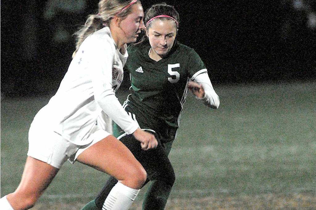 Keith Thorpe/Peninsula Daily News
Enumclaw's Lauren Boger, left, and Port Angeles'  Mia Gagnon go after the ball on Tuesday night in Port Angeles.