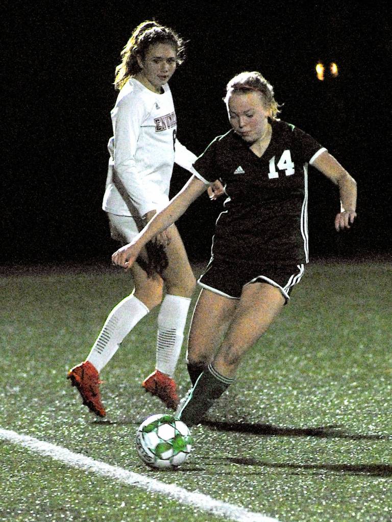 Anna Petty, front, keeps the ball inbounds as Enumclass Sofia Smits keeps watch on Tuesday in Port Angeles. (Keith Thorpe/Peninsula Daily News Port Angeles)