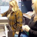 Jefferson County Elections Coordinator Quinn Grewell, left, and Chief Deputy Auditor Brenda Huntingford tabulate ballots Wednesday afternoon in the Auditors Office for the second round of ballot counts released late in the afternoon. (Zach Jablonski/Peninsula Daily News)