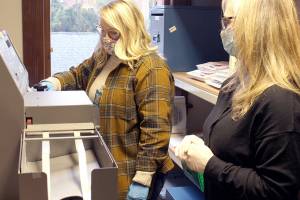 Jefferson County Elections Coordinator Quinn Grewell, left, and Chief Deputy Auditor Brenda Huntingford tabulate ballots Wednesday afternoon in the Auditors Office for the second round of ballot counts released late in the afternoon. (Zach Jablonski/Peninsula Daily News)
