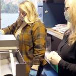 Jefferson County Elections Coordinator Quinn Grewell, left, and Chief Deputy Auditor Brenda Huntingford tabulate ballots Wednesday afternoon in the Auditors Office for the second round of ballot counts released late in the afternoon. (Zach Jablonski/Peninsula Daily News)