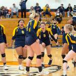 Courtesy Eric Trent/The Chronicle
Forks celebrates after downing Onalaska in a loser-out district volleyball tournament game at Napavine High School. The Spartans fell 3-2 to Rainier in a winner-to-state, loser-out contest later Wednesday evening.