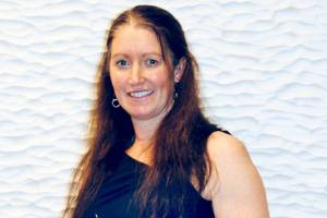 Victoria Jones, race director of the Port Angeles Marathon Association, displays the 2021 Washington State Event Organizer of the year award she was given by the Washington Festivals & Events Association.