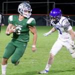 Port Angeles' Jaziel Livingston (6) outpaces North Mason Bulldog Dakota Filer (7) as he runs around right end for a good gain on the gridiron Friday at Civic Field. Livingston had 93 yards rushing and a touchdown in the 47-6 win. (Dave Logan/for Peninsula Daily News)