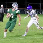 Port Angeles Jaziel Livingston (6) outpaces North Mason Bulldog Dakota Filer (7) as he runs around right end for a good gain on the gridiron Friday at Civic Field. Livingston had 93 yards rushing and a touchdown in the 47-6 win. (Dave Logan/for Peninsula Daily News)