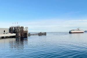 The M/V Coho leaves Port Angeles Harbor on Monday morning on its way to Victoria for the first time since March 2020. The COVID-19 pandemic shut down travel between the two countries as both land and sea borders had been closed. For more on the reopening, see Tuesdays print editions. (Scott Gardinier/Peninsula Daily News)