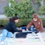 PHOTO BY: Nathan Byers/Sequim Adventist Church 

CAPTION: Teen leaders Ava Hubbard, of Port Townsend, on the left, and Briangela Vanwart, of Sequim, paint scenery in preparation for the Rocky Railroad Kids’ Night