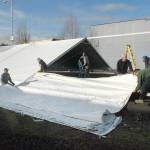 Keith Thorpe/Peininsula Daily News
A work crew erects a tent on Wednesday that will cover a temporary ice skating rink to be installed for the annual Winter Ice Village in the 100 block of West Front Street on downtown Port Angeles. Daily ice skating will begin on Nov. 19 and continue through Jan. 3.