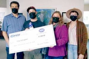 Jackpot (Standalone) 

Troy Gallagher of Port Angeles, second from left, accepts a $1,000 jackpot from Express Employment Professionals employees Duane Folden, left, Shelley Mills and Kendra Lucke. Gallagher is one of 24 jackpot winners from across the country. 

The firm has 830 offices and more than 500,000 employees nationanwide.