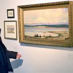 Jenny Westdal, Jefferson County Historical Society board president, admires one of Adeline Willoughby McCormacks paintings in the Women Outdoors show at the Jefferson Museum of Art & History. (Diane Urbani de la Paz/Peninsula Daily News)
