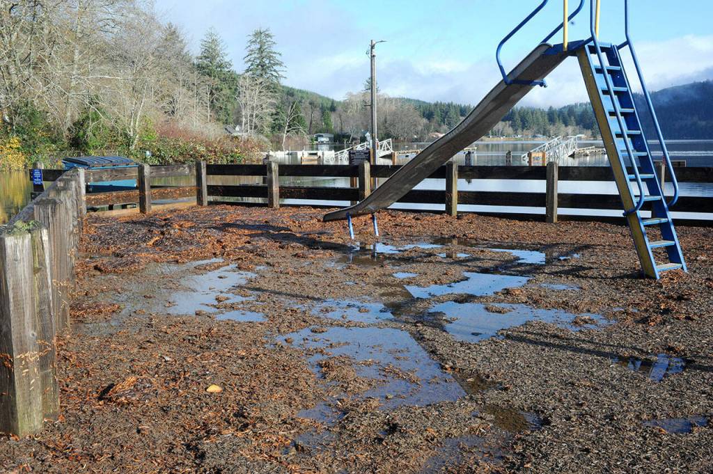 A mess of debris was left at the playground at the Lake Pleasant County Park as seen Tuesday morning as the lake began to descend.  Water also spilled over West Lake Pleasant Road Monday with the park completely flooded.  Photo by Lonnie Archibald.