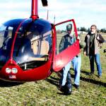 J.D. Crow, pilot and owner a helicopter used by Green Crow Co., left, prepares to board Clallam County road engineeer Joe Donisi, center, and Clallam Couny Sheriff's Sgt. John Keegan, the county's emergency  operations supervisor, for an aerial inspection of county roads on Tuesday. (Alan Barnard)