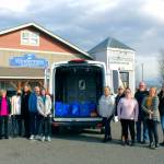 Pictured, from left, are Dave Sharman, Susan Barger, Svea Sparks, Dollie Sparks, Alan Burwell, Carol Dana, Andra Smith from the Sequim Food Bank and Jody McLean, Jessica Warriner, Rick Brown, Marcee Medgin and Tatiana Wild from Windermere.