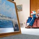 Pearl Harbor survivor and World War II Navy veteran David Russell, 101, reads a birthday card in Albany, Ore., while talking about his time aboard the USS Oklahoma and his life after the war. (Nathan Howard/The Associated Press)