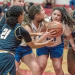 East Jeffersons Aurin Asbell, with ball, and Alyssa Vandenberg are blocked by Annie Wrights Jazmyn Stone 21 and Leah Kearns, 22, and Rae Wartell as she goes for the basket during a game Thursday at Port Townsend High School. (Steve Mullensky/for Peninsula Daily News)