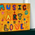 A local artist made a sign last year for inside the Winter Welcoming Center, and its back up this season at the Pope Marine Building. (Diane Urbani de la Paz/Peninsula Daily News)