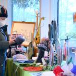 Kathleen McCowan of Seattle browses the goods at the Wintertide Makers Market, which wraps this Sunday at the Port Angeles Fine Arts Center. (Diane Urbani de la Paz/Peninsula Daily News)