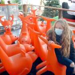 Madison Estus, 10, of Lacey takes a break from ice skating among a collection of skating aids at the Port Angeles Winter Ice Village over the weekend. The village offers daily ice skating from 9 a.m. to 9 p.m. through Jan. 3. (Keith Thorpe / Peninsula Daily News)