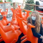 Madison Estus, 10, of Lacey takes a break from ice skating among a collection of skating aids at the Port Angeles Winter Ice Village over the weekend. The village offers daily ice skating from 9 a.m. to 9 p.m. through Jan. 3. (Keith Thorpe / Peninsula Daily News)