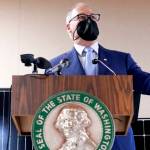 Ted S. Warren / The Associated Press
Gov. Jay Inslee announces several climate-related proposals for the 2022 legislative session during a news conference Monday in Olympia, including a plan to offer rebates on new and used electric vehicles.