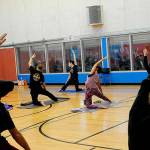 Kitty Sokkappa leads a yoga class at the YMCA of Sequim. Its one of the biggest at the facility, staff say. Starting Jan. 1, club members and participants ages 12 and older in all North Olympic Peninsula YMCAs must provide proof of COVID-19 vaccine or a negative test before participating in events. (Matthew Nash/Olympic Peninsula News Group)