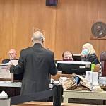 State Patrol Detective Michael Grall, left, is questioned by Clallam County Deputy Prosecuting Attorney Jesse Espinoza in Dennis Marvin Bauers triple-murder trial in Clallam County Superior Court. (Rob Ollikainen/for Peninsula Daily News)