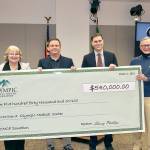 Dave Logan
Holding a giant check of the $540,000 donation from the Olympic Medical Center Foundation to the hospital are, from left, OMC Executive Committee member Karen Rogers, OMC Commissioner Chair John Nutter, OMC CEO Darryl Wolfe, and Bruce Skinner, executive director of the foundation.