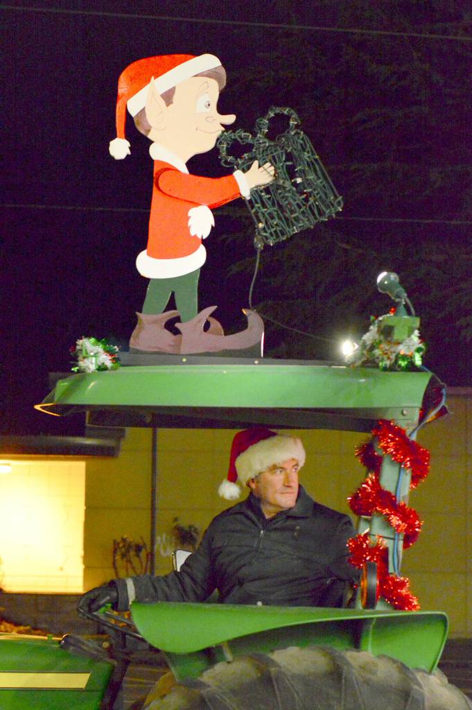 East Jefferson Fire & Rescue Battalion Chief Justin Clouse pulls the Christmas truck out of the Uptown fire station for a jaunt through Port Townsend and Port Hadlock on the nights just before Christmas. (Diane Urbani de la Paz/Peninsula Daily News)