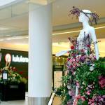 Sid Anna Sherwood, owner of Annies Flower Farm in Sequim, created Flora, goddess of blooming flowers, for the Fleurs de Villes show at Pacific Place in Seattle. The 18-piece display stays up through Monday. (Diane Urbani de la Paz/Peninsula Daily News)