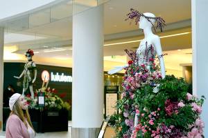 Sid Anna Sherwood, owner of Annies Flower Farm in Sequim, created Flora, goddess of blooming flowers, for the Fleurs de Villes show at Pacific Place in Seattle. The 18-piece display stays up through Monday. (Diane Urbani de la Paz/Peninsula Daily News)
