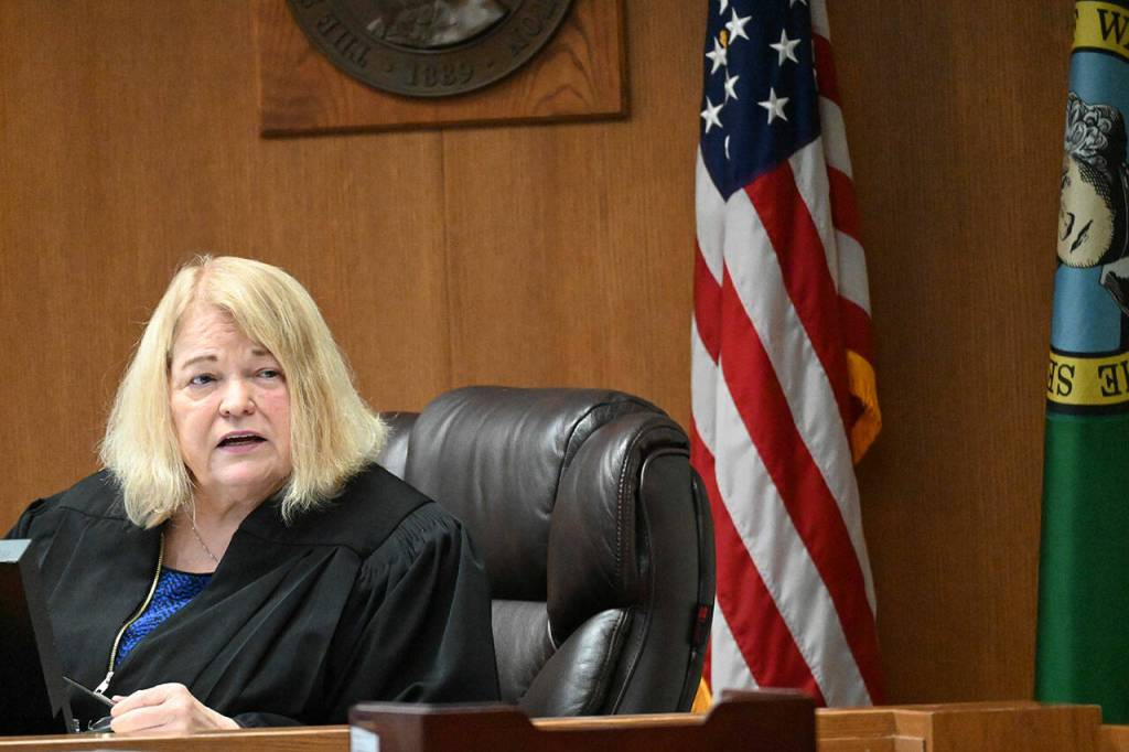 Superior Court Judge Lauren Erickson prepares to leave the courtroom last week after presiding over Dennis Bauers triple murder trial. (Paul Gottlieb/Peninsula Daily News)