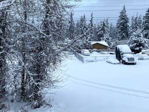 Nearly a foot of snow fell in areas of the North Olympic Peninsula, including a neighborhood near Golf Course Road in Port Angeles. (Brian McLean/Peninsula Daily News)