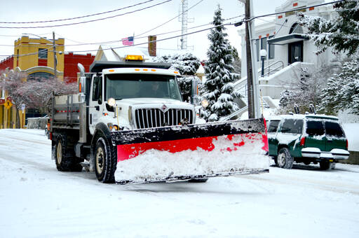 A Port Townsend street maintenance truck sands Lawrence Street on Sunday afternoon. (Diane Urbani de la Paz/Peninsula Daily News)