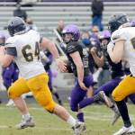 Michael Dashiell/Olympic Peninsula News Group
Sequim's Walker Ward runs with the football against Bainbridge during a February game, one of the first prep sporting events held in 11 months due to the pandemic.