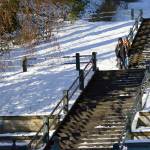 Patrick Jennings and Virginia Grace of Port Townsend descend the Taylor Street steps into downtown Port Townsend on Thursday afternoon. The sun broke through the clouds during the late morning, sending the temperature 1 degree above freezing. (Diane Urbani de la Paz/Peninsula Daily News)