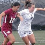 Keith Thorpe/Peninsula Daily News
Pierce's Regina Garay, left, and Peninsula's  Grace Johnson chase a loose ball on Saturday in Port Angeles.