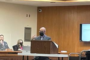 Rob Ollikainen/for Peninsula Daily News
Clallam County Deputy Prosecuting Attorney Jesse Espinoza makes a closing argument in Dennis Marvin Bauer’s triple-murder trial in Clallam County Superior Court on Wednesday. Sheriff’s Sgt. Jeff Waterhouse and Chief Criminal Deputy Prosecuting Attorney Michele Devlin look on.