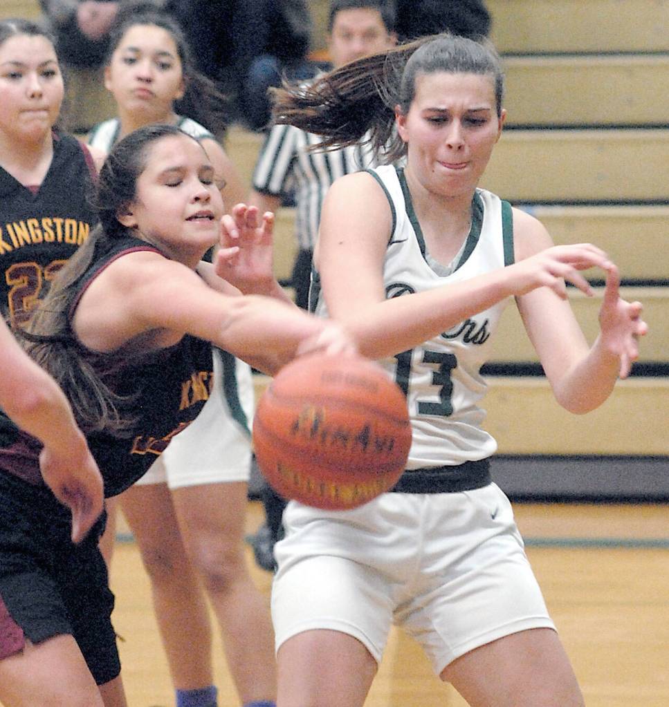 Keith Thorpe/Peninsula Daily News Kingstons Brianna Joprgensen, left, attempts to stip the ball from Port Angeles; Bailee Larson during Thursday nights game in Port Angeles.