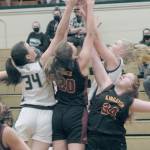 Keith Thorpe/Peninsula Daily News
Port Angeles' Lexie Smith, left, and Paige Mason, upper right, battle for a rebound with Kingston's Ellee Brockman and Kian Mills, right, in the second quarter on Thursday in Port Angeles.