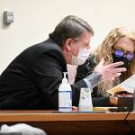 Paul Gottlieb/Peninsula Daily News

Dennis Bauer confers with lawyer Karen Unger.