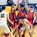 Forks Riley Pursley (1) eyes the ball beneath the Wahkiakum defense from left Titan Niemela, Dominic Curl, and Tanner Collupy. Looking on is Spartan Brody Lausche (22). Photo by Lonnie Archibald.