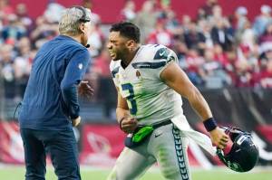 Seattle Seahawks quarterback Russell Wilson (3) celebrates a touchdown against the Arizona Cardinals with Seahawks head coach Pete Carroll, left, during the second half of an NFL football game Sunday, Jan. 9, 2022, in Glendale, Ariz. (AP Photo/Ralph Freso)