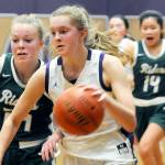 Michael Dashiell/Olympic Peninsula News Group
Sequim's Jolene Vaara, right, dribbles upcourt while Port Angeles' Anna Petty attempts to shield Vaara from heading to the basket during the Wolves' 60-55 win over the Roughriders.