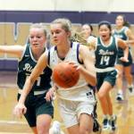 Michael Dashiell/Olympic Peninsula News Group Sequims Jolene Vaara, right, dribbles upcourt while Port Angeles Anna Petty attempts to shield Vaara from heading to the basket during the Wolves 60-55 win over the Roughriders.