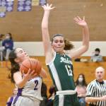 Bailee Larson Michael Dashiell/Olympic Peninsula News Group Port Angeles Bailee Larson prepares to swat the shot of Sequims Hannah Bates in the first half of Sequims 60-55 victory Tuesday.