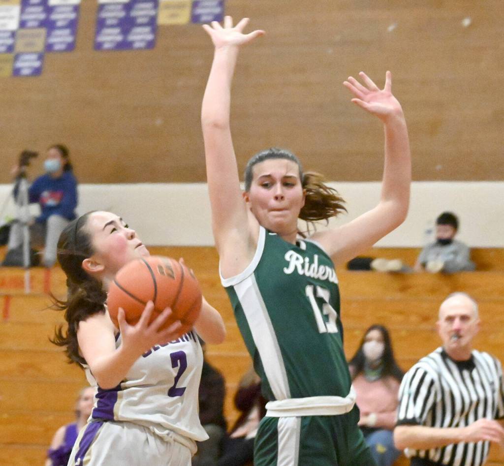 Bailee Larson Michael Dashiell/Olympic Peninsula News Group Port Angeles Bailee Larson prepares to swat the shot of Sequims Hannah Bates in the first half of Sequims 60-55 victory Tuesday.