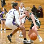Michael Dashiell/Olympic Peninsula News Group Port Angeles Anna Petty dribbles inside while defended by Sequims Jelissa Julmist during the Wolves 60-55 victory Tuesday.