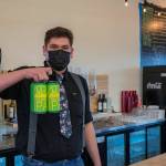 Sequims newest source of pizza and drinks, Barhop Brewing Artisan Pizza, features brews by Josh Blue, one of which  Citrasonic IPA, seen here held up by manager Andy Guillen-Givins  can now be found in local stores. (Emily Matthiessen/Olympic Peninsula News Group)
