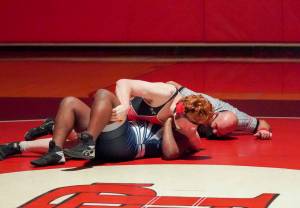 East Jefferson senior Gage Berry, top, pins Cascade Christians Aphelele Mzameko in the 182-pound weight class during the Rivals senior night victory over the Cougars on Wednesday at Port Townsend High School. (Steve Mullensky/for Peninsula Daily News)